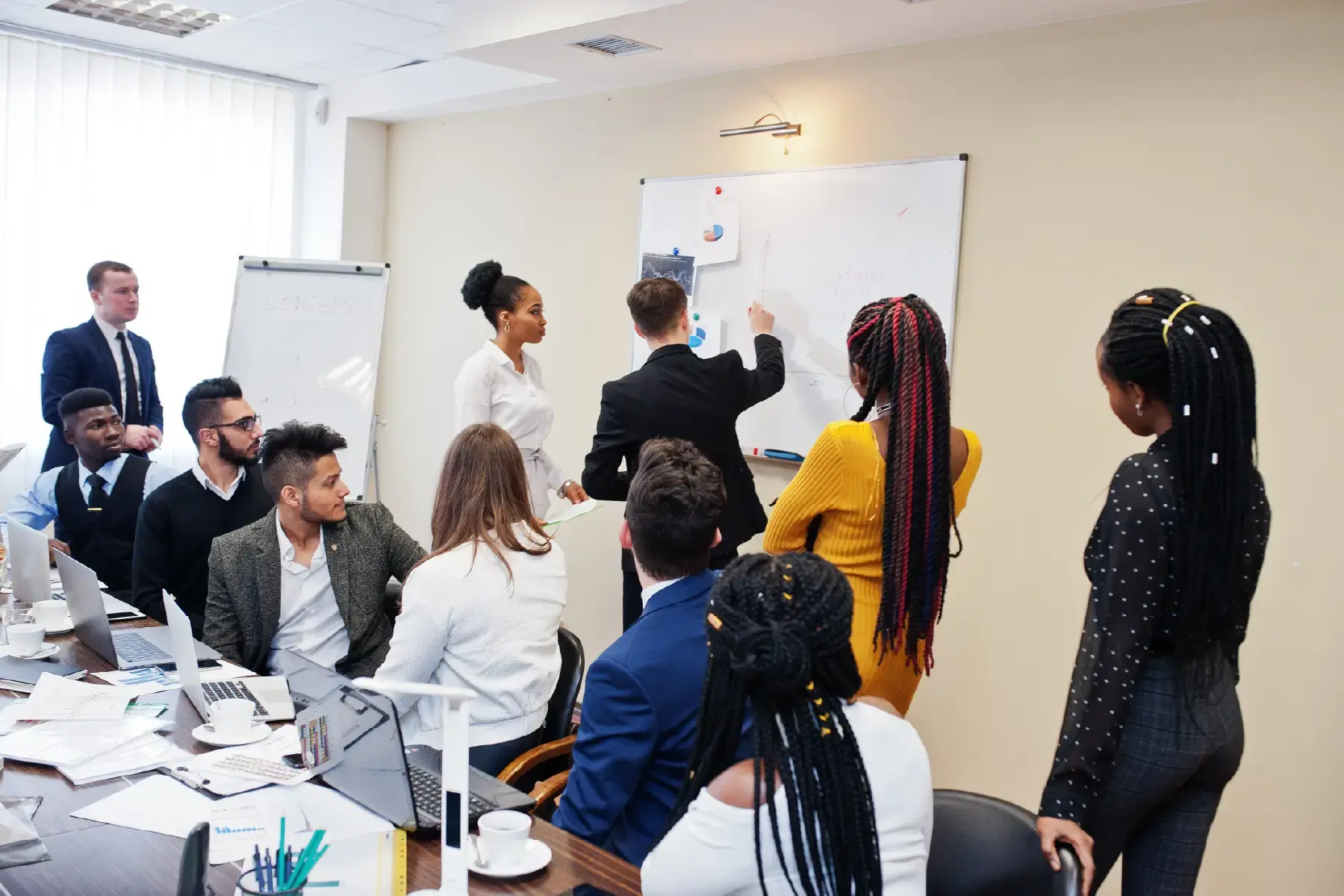 Cross-functional team in a strategy session aligning on market messaging for a complex rail sector product launch