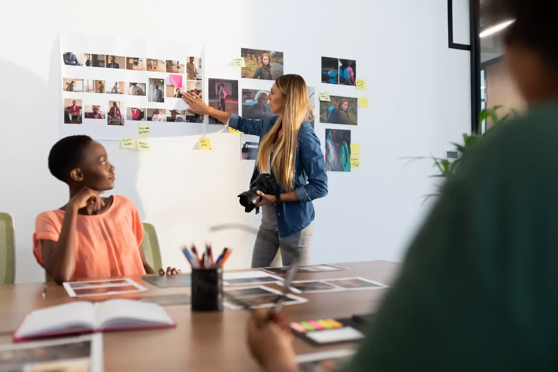 Creative team reviewing design concepts and moodboards in a collaborative workspace